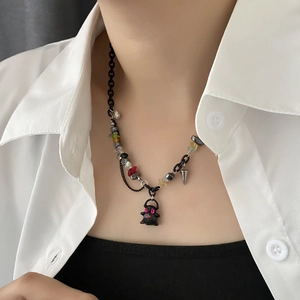 Ghost pendant necklace with colorful beads and black coated alloy chain on model