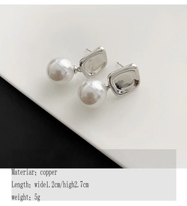 Macro shot showing copper pearl earrings dimensions of 1.2cm x 2.7cm and 5g weight