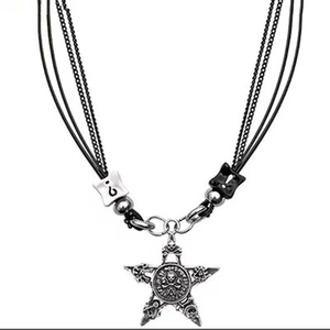 Gothic punk pentagram star necklace with skull relief on black rope and metal chain