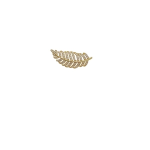 Elegant gold leaf brooch with micro-pave cubic zirconia on a minimalist white background