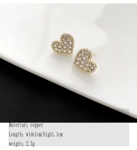 Detail showing heart pearl stud earrings with copper base size 1cm by 1.1cm and 2.5g weight