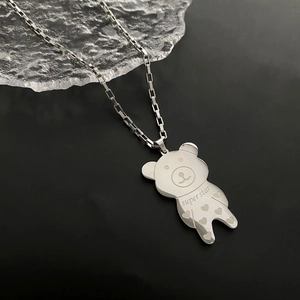 Minimalist silver bear pendant necklace with laser engraving on black frosted background