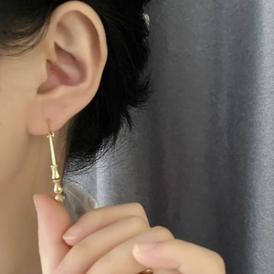 Elegant gold bamboo style drop earrings for women with high-end polished metal finish