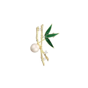 Elegant gold bamboo brooch with green enamel leaves, a large pearl, and zircon accents
