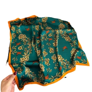 Elegant dark green silk square scarf featuring peach blossoms and bird print with orange border