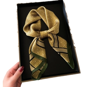 Satin silk scarf with gold geometric pattern and green border in a black gift box