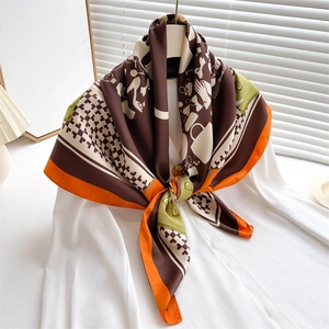 Elegant 90cm printed satin silk scarf with orange and green patterns on white shirt