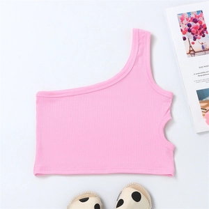 Detail of pink ribbed knit girls' one-shoulder crop top with side cutout on white surface