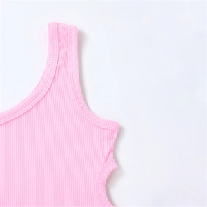 Detailed macro view of the pink ribbed knit fabric texture and shoulder strap stitching