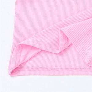 Close-up of pink ribbed knit fabric showing the double-needle hem and texture