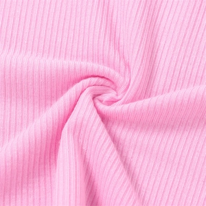 Detail of pink ribbed knit fabric with soft texture and elastic vertical stripes