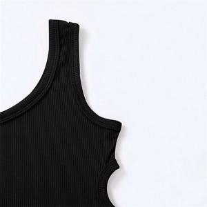 Close-up of black ribbed fabric texture and high-quality hem stitching on girl's tank top