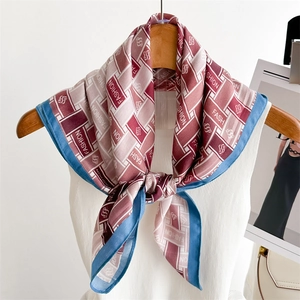 Fashionable geometric square silk scarf with FASHION lettering and blue contrast border