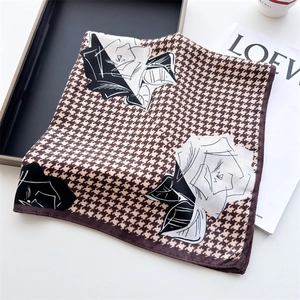 Houndstooth silk scarf with rose floral pattern for women on white surface