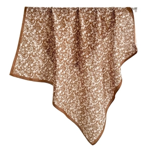 Brown floral square scarf with silk-like sheen and dark brown border on white background