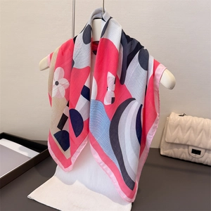 Detail of colorful abstract geometric silk scarf hanging with a modern floral pattern