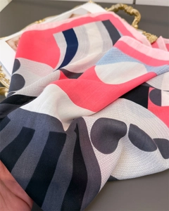Detailed view of silk-like scarf with geometric wave patterns and soft twill texture