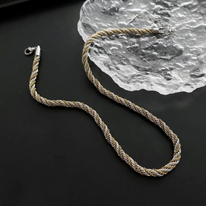 Two-tone gold and silver rope chain necklace with a lobster clasp and adjustable link