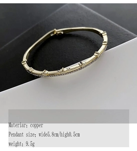 Detailed view of gold copper bangle with micro-pave zircons and 5.8cm diameter