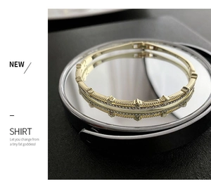 Detail of adjustable gold zircon bracelet featuring crown rivet edges and double row stones