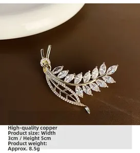 Detailed macro view of wheat leaf brooch with marquise cubic zirconia on copper base