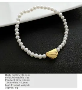 Detail of minimalist pearl bracelet with an 18K gold-plated titanium steel geometric charm