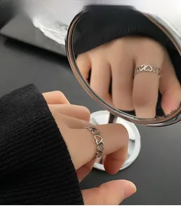 Detailed view of hollow heart pattern ring reflecting in a small round mirror
