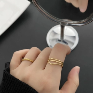 Minimalist double-layer gold titanium steel rings set featuring geometric wave design