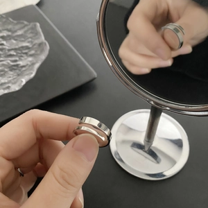 Detailed mirror view of silver double-layered titanium steel adjustable open ring