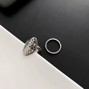 Minimalist silver geometric hollow ring set with honeycomb mesh pattern in stainless steel