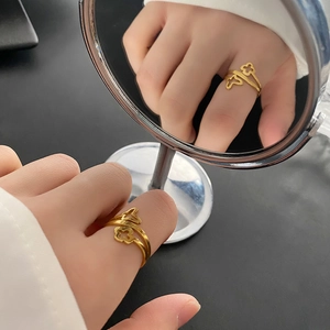 French style gold plated titanium clover ring with double-layered hollow butterfly design