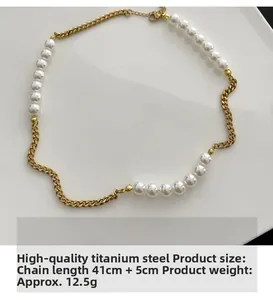 Detail of titanium steel curb chain and imitation pearls with lobster clasp and extension