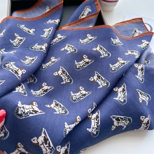 Detail of herringbone weave and vintage horse carriage pattern on square scarf