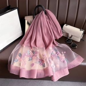 Detailed pink silk scarf with floral embroidery and pearls on organza border