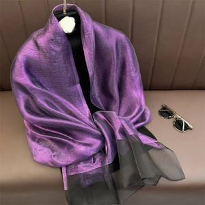 Detail of purple metallic silk scarf with black sheer tulle trim and fine texture