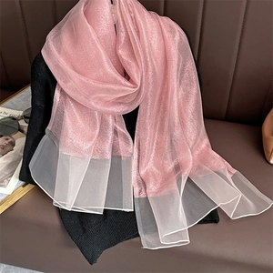 Detail of pink glitter silk scarf with pearlescent shimmer and sheer wide border