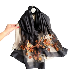 Elegant black silk scarf with orange floral embroidery and sheer panel for women
