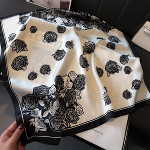 Elegant black and white floral silk square scarf with camellia print and satin finish