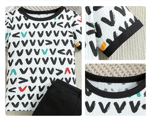 Detail view of baby boy summer rib-knit short sleeve tee and shorts set with V-shaped prints