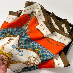 Detail of silk-like chain print scarf with equestrian motifs and baroque patterns