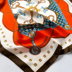 Satin square scarf with vintage golden chain, key, and ribbon prints in vibrant orange