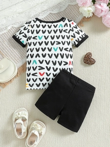 Infant boy summer two-piece outfit featuring V-pattern short sleeve t-shirt and black shorts