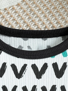 Infant boys summer knit outfit with ribbed white fabric and graphic pattern detail