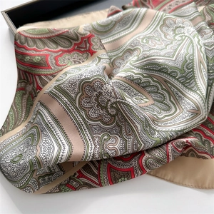 Detail of vintage geometric paisley print silk scarf with fine rolled edge craftsmanship