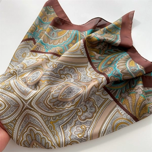Detail of vintage paisley pattern on silk-like scarf with fine rolled edges