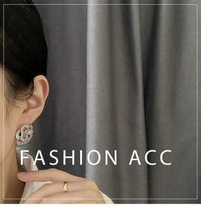 Macro side view of silver floral earrings with pave crystals and elegant hollow design