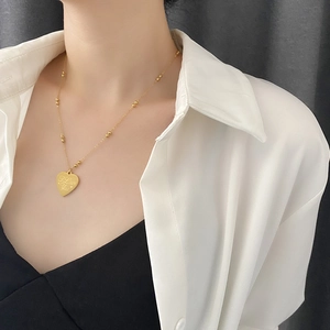 Elegant gold titanium steel heart necklace with I Love You engraving and beaded chain
