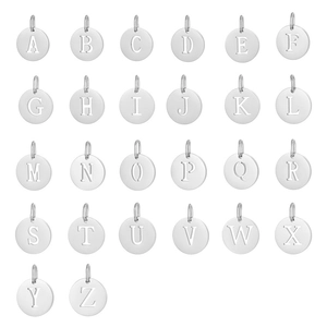 Macro shot of 26 round stainless steel alphabet letter charms for DIY jewelry making