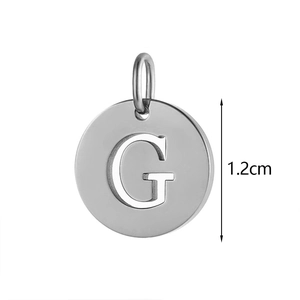Detailed view of silver stainless steel 1.2cm round pendant with engraved letter G