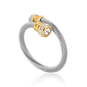 Silver twisted cable ring with gold diamond-encrusted ends on a white background